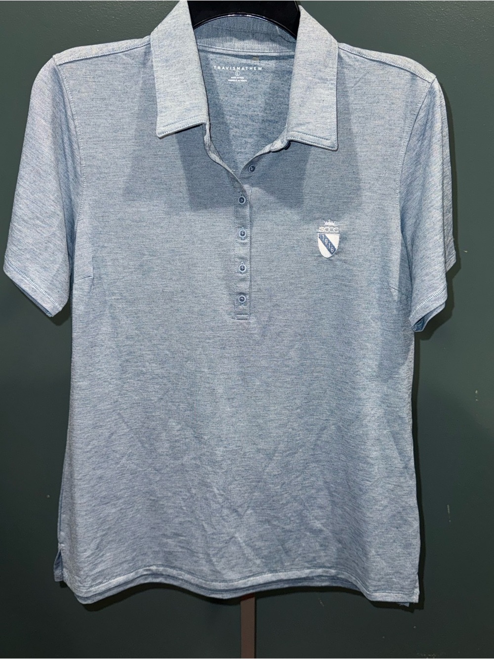 Travis Mathew Heathered Sky Blue Polo with Crest